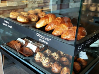 Picture of croissants and muffins in a display in a coffee shop in Unionville, Markham Ontario